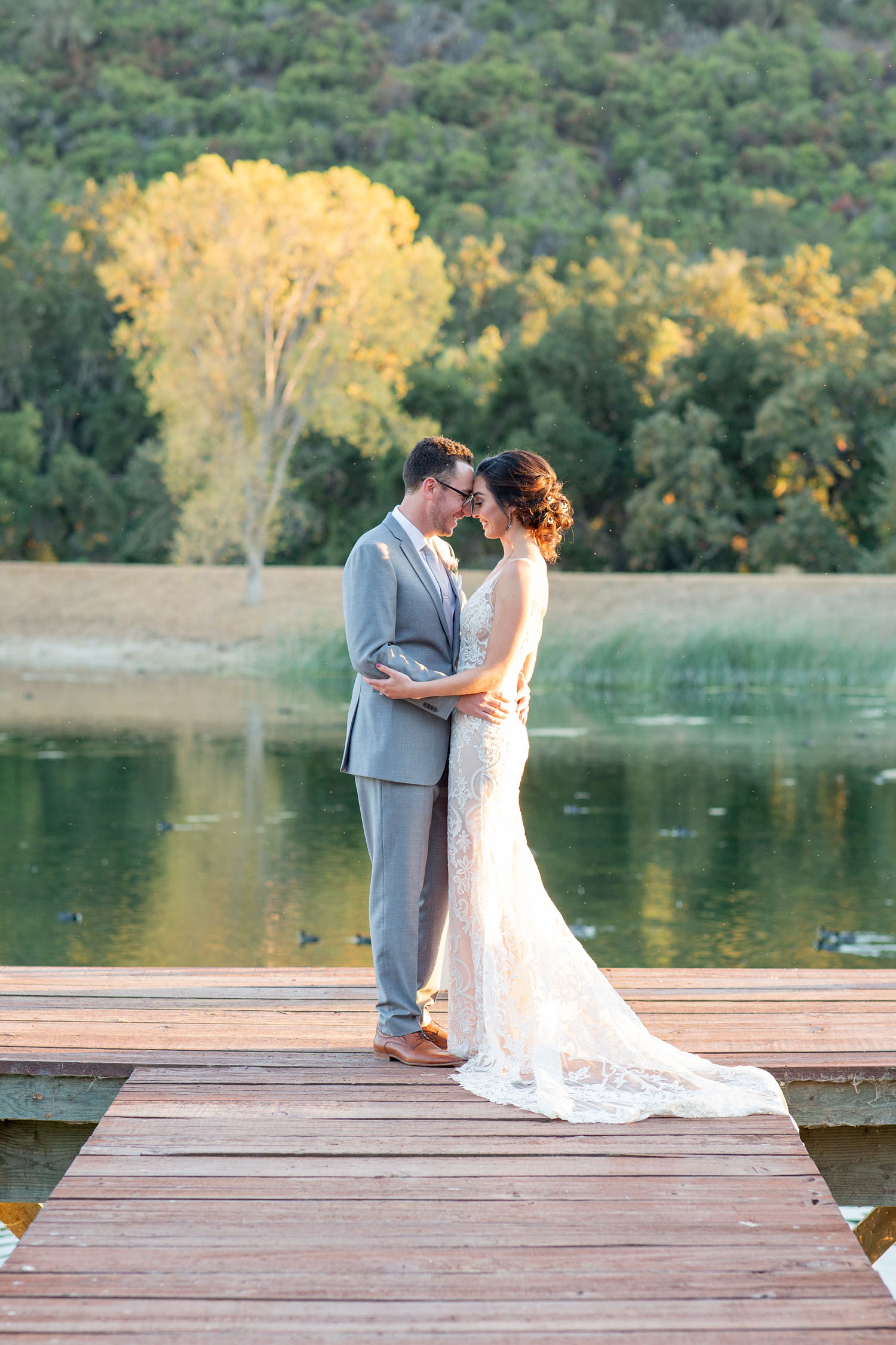 bride and groom stand on dock of Halter Ranch