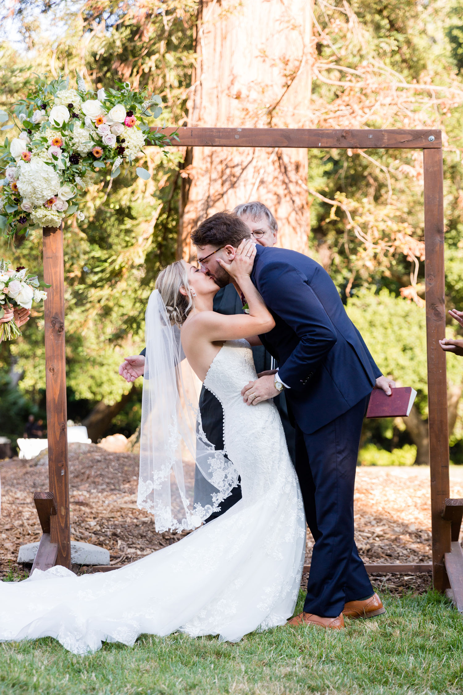 Jennifer and Aaron kissing at Ardenwood wedding ceremony