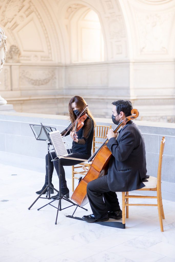 Musicians playing during 4th floor wedding ceremony