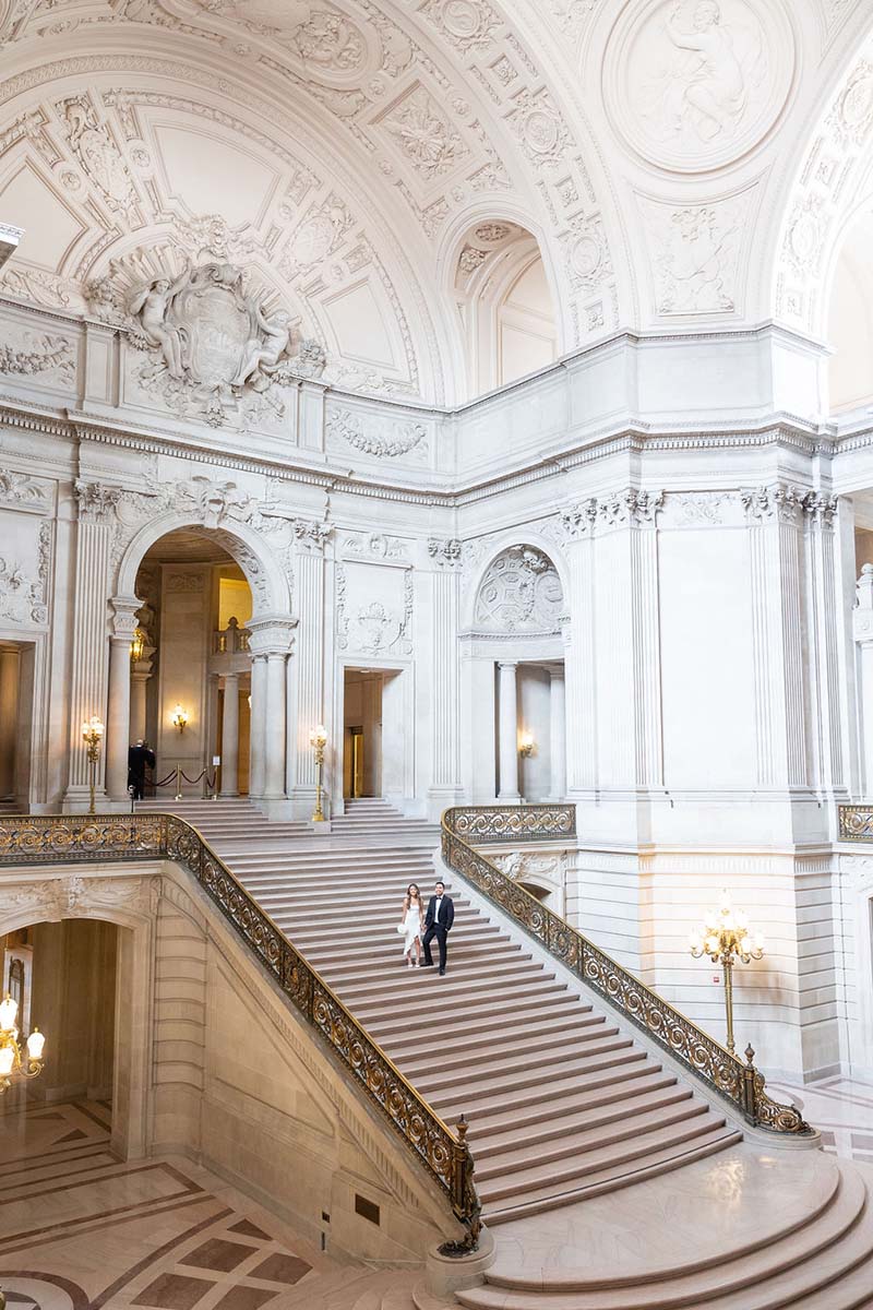 Wedding photo on grand staircase of SF City Hall