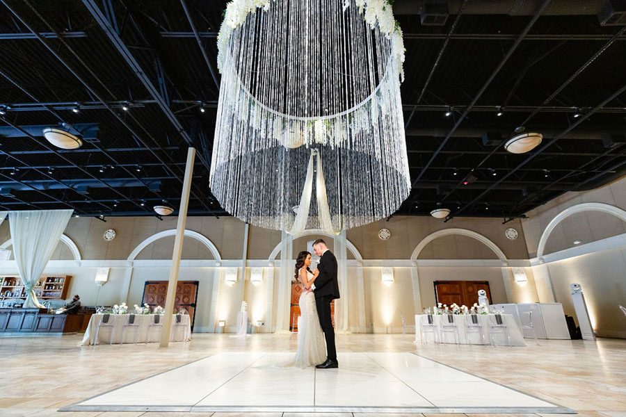 Rosa and Zach wedding photo at Casa Real in Pleasanton in the Bay Area - dancing under chandelier