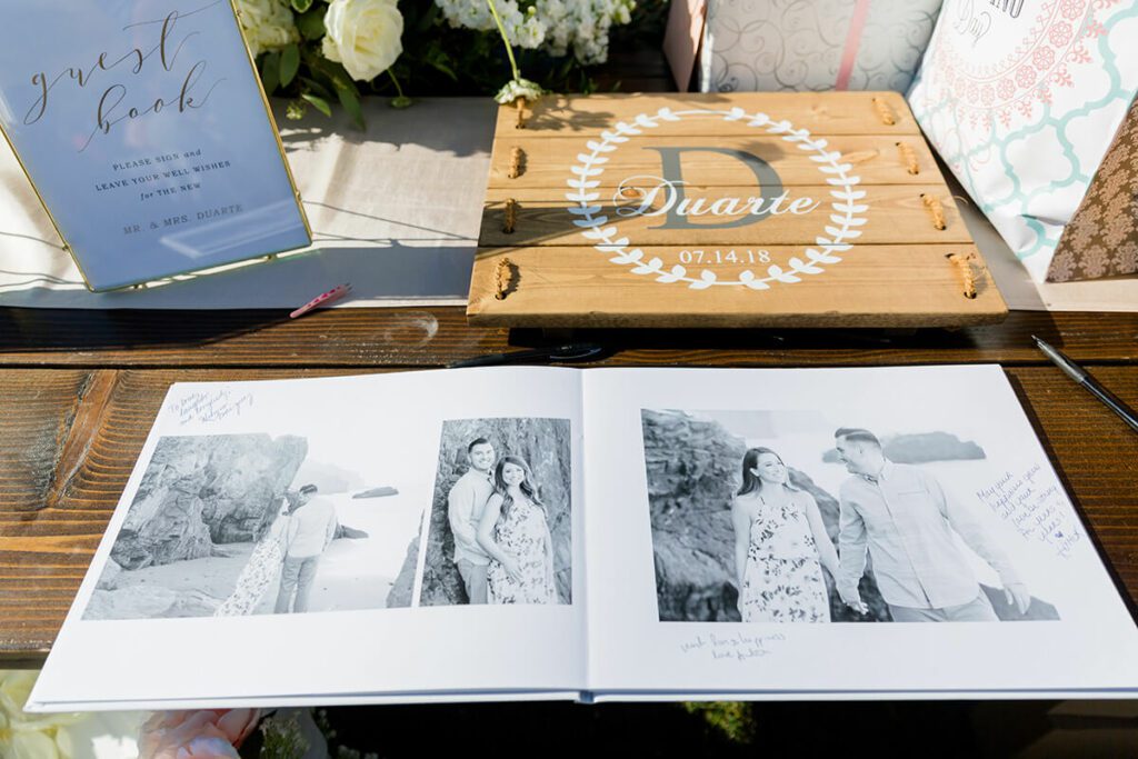 Black and white engagement photos in wedding guest book