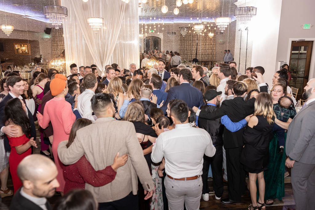 Giant group hug during reception at Casa Bella in Sunol